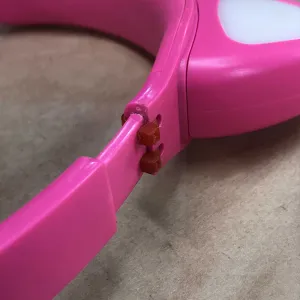 Pink headphones with zip tie